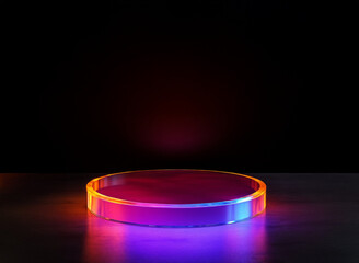 Poster - Circular translucent podium illuminated with vibrant colors against a dark background