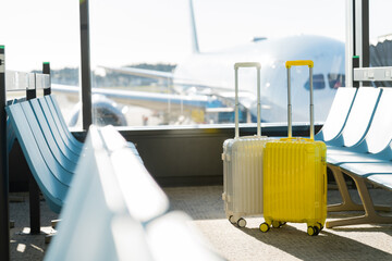 Fototapete - Two suitcases in an empty airport hall, traveler cases in the departure airport terminal waiting for the area, vacation concept, blank space for text message or design, luggage for travel vacation.