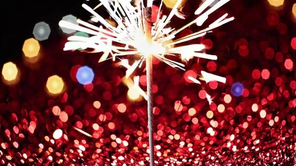 Aufkleber - Sparkler with bright bokeh lights, festive and celebratory atmosphere. New year's eve celebration concept