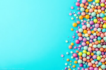 Poster - Colorful Assortment of Vibrant Round Balls on a Bright Blue Background Perfect for Decorative and Creative Projects
