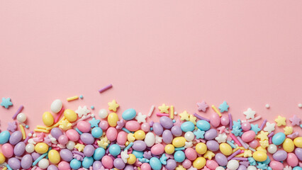 Leinwandbilder - A bird's-eye view of vibrant bakery sprinkles intended for Easter cakes, dispersed over a pink backdrop