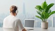 © Nattapol - Focused man working with laptop city view modern lifestyle