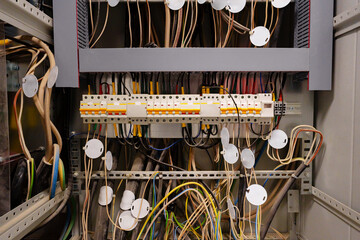 Poster - Close view of complex electrical wiring in a control panel at a technology facility