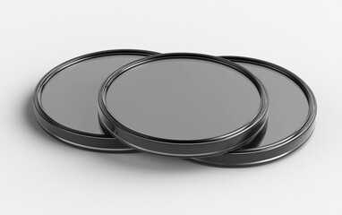 Poster - Three round black metallic discs overlapping.