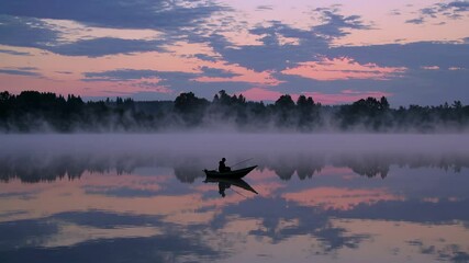 Aufkleber - Early morning fishing on a serene lake with mist and beautiful reflections at dawn