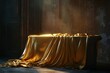 © VisualCrafter - Golden cloth draped over antique stone table in dark room.