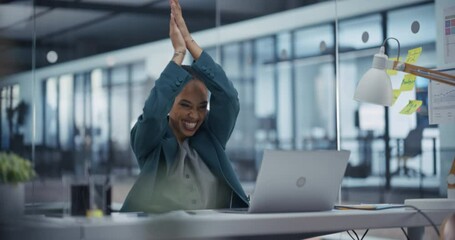 Aufkleber - Young Skilled African Manager Efficiently Completes a Complex Task On Her Laptop Computer. Black Female Employee Expresses Enthusiasm, Happy and Excited to Share the Moment