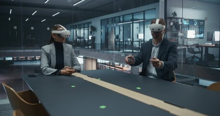 Leinwandbilder - Template Footage for Inserting a Digital Object into an Office Meeting Room Scene with Two People Wearing Virtual Reality Headsets and Using Controllers while Having a Business Conversation