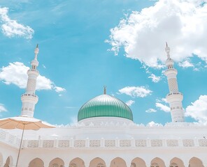 A beautiful photograph of the exterior view of the Nabawi Mosque in Mecca, Saudi Arabia, with a green dome, white walls, 