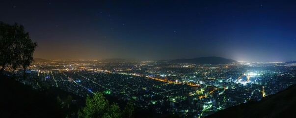 Poster - A panoramic view of a city skyline at night, with lights twinkling like stars against the dark sky.