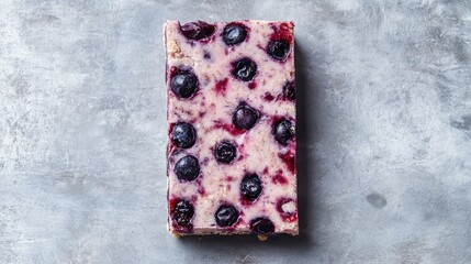 Poster - Delicious Soft Baked Blueberry Bar with Vibrant Blueberries on a Subtle Gray Textured Background Ideal for Culinary Stock Photography
