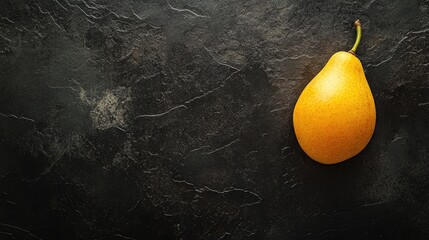 Aufkleber - Single ripe mango placed on a textured dark surface creating a striking contrast in color and composition for culinary or lifestyle visuals.
