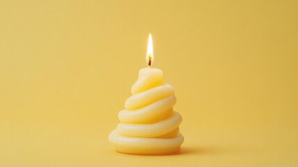 Poster - Single yellow candle with a coiled wax design illuminated on a vibrant yellow background creating a warm and inviting atmosphere