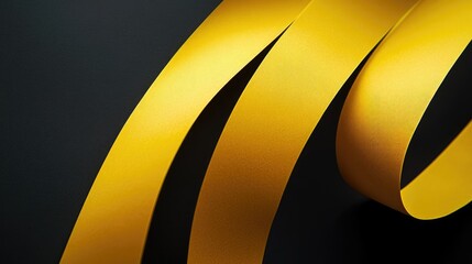 Poster - yellow satin ribbons elegantly draped on a dark background creating a sophisticated and stylish visu