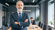 © Gil Macedo - Businessman with arms crossed in the company meeting room