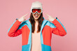 © ViDi Studio - Young woman in warm blue padded jacket point finger on ski goggles mask spend extreme weekend winter season in mountains hold snowboard looking camera isolated on plain pink background Hobby concept