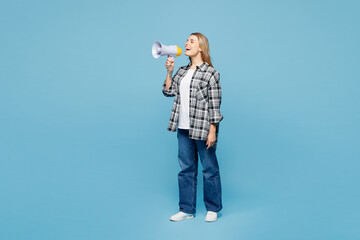 Wall Mural - Full body young woman wears checkered grey shirt casual clothes hold in hand megaphone scream announces discounts sale Hurry up isolated on plain pastel light blue cyan background. Lifestyle concept.