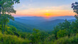 © Zinnat - Breathtaking Mountain Sunset View, A panoramic view of a mountain range at sunset.