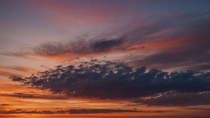 Wall Mural - vibrant sunset over the ocean with colorful clouds and tranquil horizon at dusk