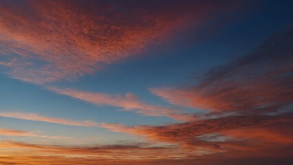 Wall Mural - colorful sunset sky with wispy clouds over a tranquil landscape in the evening