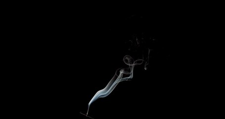 Wall Mural - Real smoke on a black background. Thin Flexible Trickle of Real Smoke. Colorful real smoke rises up. Ideal for background or over-layer with blending mode add, screen, lighten.
