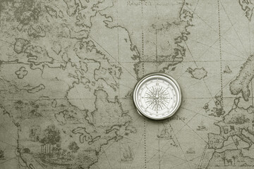 Wall Mural - classic round compass on background of old vintage map of world
