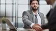 © Katsiaryna - business man greets the employee with a handshake,