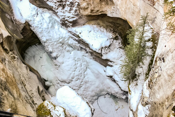 Wall Mural - A snow covered mountain with a large hole in the middle