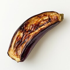 Poster - Roasted eggplant half displaying tender texture and rich color against a plain background