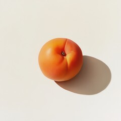 Aufkleber - Ripe apricot with soft orange skin resting on a light surface casting a subtle shadow