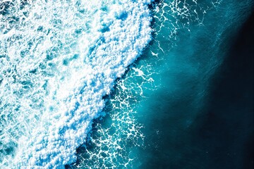 Poster - Stunning aerial view of ocean waves crashing with vibrant foam and turquoise water.