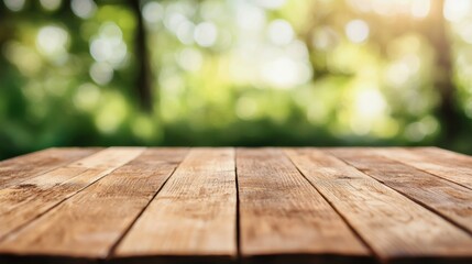 Fototapete - Empty wooden table with blurred green forest background