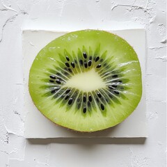 Poster - Sliced kiwi showcasing vibrant green color and black seeds on a white background
