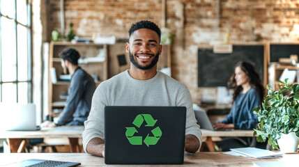 Poster - Man smiling with laptop displaying a green recycle symbol in an office space