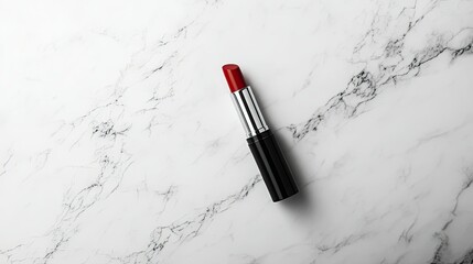 Wall Mural - Sleek red lipstick in an elegant black and silver tube resting on a clean white marble background. Minimalist beauty composition.