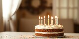 Birthday cake with candles lit on the table, birthday celebration, cake decoration, dessert