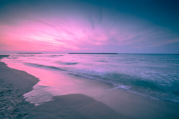 Wall Mural - seascape in the evening. sunset over the sea with a beautiful dramatic glowing sky