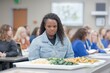 © Road Red Runner - Students in a cooking class preparing fresh vegetable dishes in a busy kitchen environment