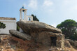 © Lars Gieger - Traditional anti pirate stone house with granite rock shelter  and Agios Georgios church at the Ikarian village of Amalou.