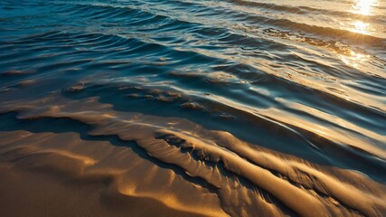 Poster - waves gently lap against the shore during sunset, casting golden hues across the serene sandy beach