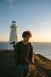 © ADDICTIVE STOCK - Young man at Cape Spear Lighthouse, Newfoundland