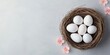 © Have a Good Day - Elegant White Easter Eggs Nestled in a Woven Nest with Pink Blossoms on Pastel White Background 35