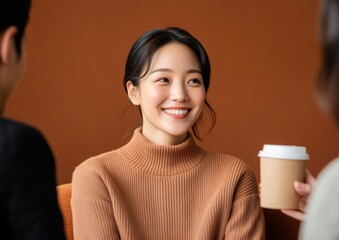 Aufkleber - Warm Minimalist Office Vibe Young Professionals in Cozy Knitwear Sharing Coffee in Chic Workspace - Boosting Team Morale and Creative Collaboration in Modern Corporate Settings