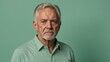 © Alteisen Riese - elderly american male in casual wear on pastel color background model portrait looking serious for ad concept space for text