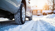 © ChrisKuz - Winter-ready car parked on snowy driveway, seasonal preparation
