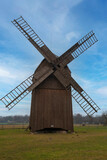 A wooden mill from the late 19th century, ancient technologies, wind power that works for people, eco-technologies, a building made of pure wood, a wind power plant from ancient times.