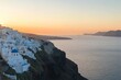 © Angelina - Oia, a charming town on Santorini island in Greece, features traditional white architecture and Greek Orthodox churches with blue domes, offering panoramic views of the Caldera and Aegean sea. Scenic
