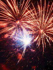 bright vibrant fireworks exploding in the night sky creating a breathtaking display of colors and li