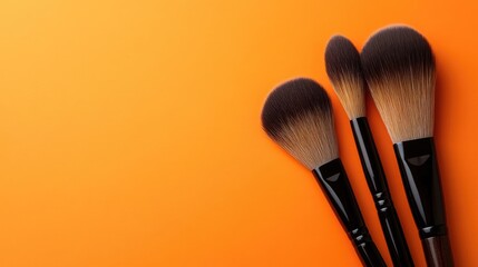 Poster - Professional contour brushes with wooden handles on a gradient orange background.