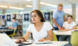© JackF - Smart female Latina student preparing for the exam in the school library